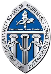 Seal of GSMST (Text around seal says "EST. 2007: THE GWINNETT SCHOOL OF MATHEMATICS, SCIENCE, AND TECHNOLOGY", text under the GCPS torch says Facultates Sine Finibus, and the text in the banners says "BIOSCIENCE ENGINEERING EMERGING TECHNOLOGIES"