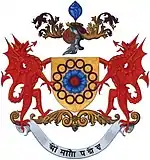 Before 1975, the motto on the coat of arms was different - OM MANI PADME HUM. (Oh, the jewel of creation is in the Lotus).