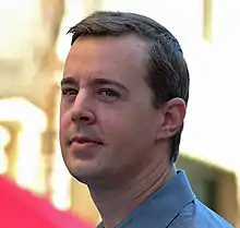 A photograph of Sean Murray attending an event.