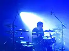 Moore performing with Manic Street Preachers in 2014