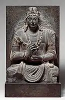 Seated Maitreya, 7th-8th century AD, near Kabul, Afghanistan. "Stylistically related to Shahi sculpture of northern Pakistan and Afghanistan".