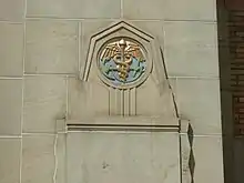 An anchor and caduceus on the exterior of a building
