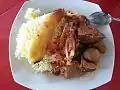 Chivo stew with white rice and plantain