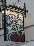 Secondary sign, with another depiction of Saint George slaying the dragon.