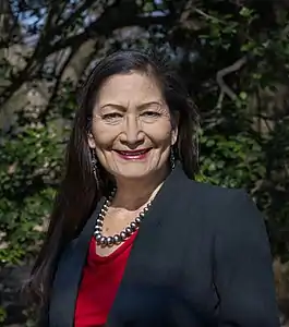 Deb Haaland is from the Laguna Pueblo people and is the first Native American Cabinet Secretary as Secretary of Interior. Her father is Norwegian-American.