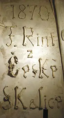 Signature of F. Rint written with bones