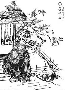 A one-eyed monk stands on the veranda of a Japanese home.