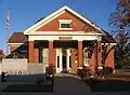 Seneca, Missouri City Hall. Note veterans monument in lower left-hand corner.