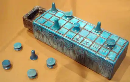 Gamepiece "tokens" (common) and a Senet gameboard