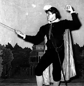 Shakespearean actor in fencing stance