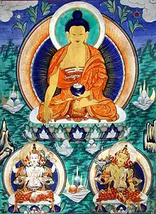 19th-century Mongolian distemper painting with highlights of gold, depicting Shakyamuni flanked by Avalokiteśvara and Manjushri. The form of Manjushri depicted here is not wielding the characteristic flaming sword, but there are many forms of the eight great bodhisattvas, some are based on the Indian tradition, and other from visions of historical masters.