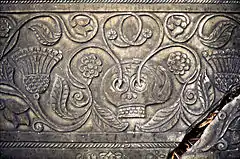Elaborately carved grave slab at Shebbear (Devon, England) showing a skull sprouting flowering shoots, as a symbol of resurrection