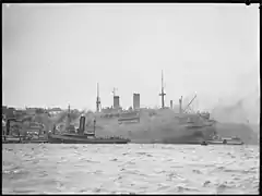 Ship surrounded by tug boats, Sydney, 1942]