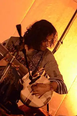 Shobhakar playing the sarod