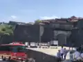 Shuri Castle's main gate and main hall's charred roof two days after the 2019 fire