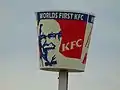 KFC bucket sign proclaims "World's First KFC on State Street and 3900 South in Salt Lake County, Utah (Jan 2020)