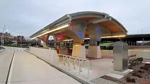 A metal canopy over a bus platform