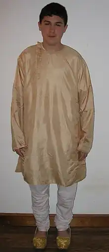 Cotton churidar worn with silk side-opening kurta and mojari shoes