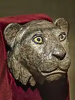 Silver lioness head finial for the arm of a chair with shell and lapis lazuli inset eyes, recovered from the royal cemetery of Ur 2550–2450 BCE, from the death pit at the entrance Puabi's chamber