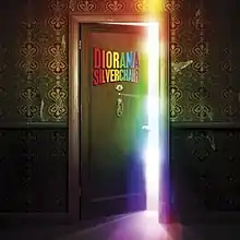 A door opening to reveal colorful light shining from the next room