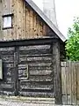 Post-and-plank construction in a house in Visby, Sweden. Timber framing with infill of logs.