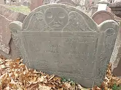 Slate Tombstone from 1740 with deaths head imagery, carved in Boston