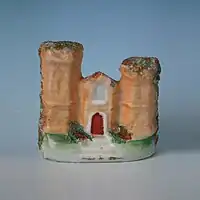 Small staffordshire pottery figure of a castle 2.6ins tall, circa 1860.