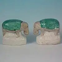 Small staffordshire pottery figures of elephants 2.4ins tall, circa 1860.