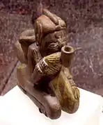 Effigy pipe from Spiro, of a man smoking a pipe