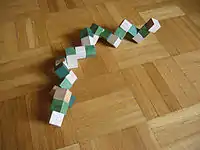 Unsolved 3×3×3 cube (forming a snake)