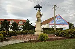 Common with statue of Saint John of Nepomuk