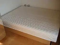 A bed with comforter