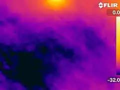 Atmospheric temperatures responsible for ice crystals around 22° halo, as viewed through a thermal camera (°C). The halo itself is not present in the thermal spectrum.  The Sun is partially visible at the top of the image.