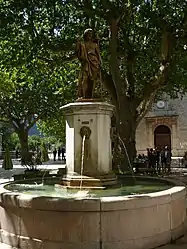 The village square and the fountain of Saint-Jean-Baptiste