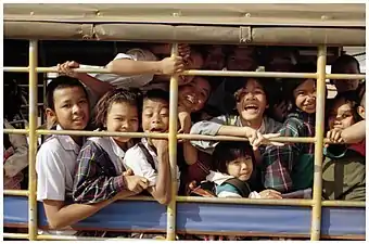 A songthaew loaded with young students on the way home from school in Amphoe Kantharalak