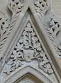 Chapter house stall canopy tympanum showing green man
