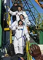 The TMA-07M crew wave to spectators before launch on 19 December 2012.