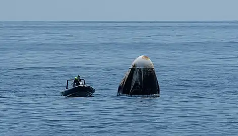 Support teams arrive in a fast boat at the SpaceX Crew Dragon Endeavour.