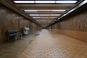 Pedestrian tunnel previously containing a pair of long moving walkways, which were removed in 2004