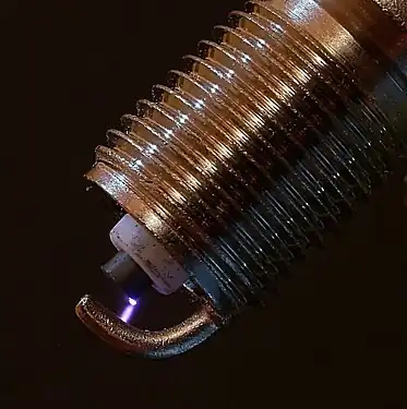 An electric spark being generated between the electrodes