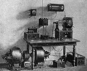 Amateur inductively coupled spark transmitter and receiver, 1910. The spark gap is in glass bulb (center right) next to tuning coil, on top of box containing glass plate capacitor
