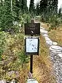 A sign at the campground located beside the Sperry Chalet