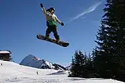 A snowboarder in the ski area Damüls-Mellau