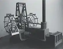 Model of a crosshead or "square" engine, showing location of engine cylinder above the crankshaft; also piston rod, crosshead, connecting rods and paddlewheels