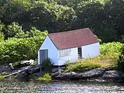 The boathouse — The ridge is parallel to the ground, but the ends and the window are vertical