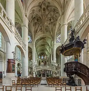 The nave, showing the rood screen, pulpit and ceiling details