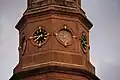 The building's steeple is adorned with clocks