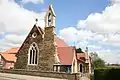 St Barnabas Church, Ranskill, Nottinghamshire, 1878 by Ewan Christian, in stone with a bellcote