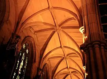 The aisles have ribbed stone vaulting with carved bosses