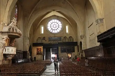 View of the nave looking west, with rose window and pulpit